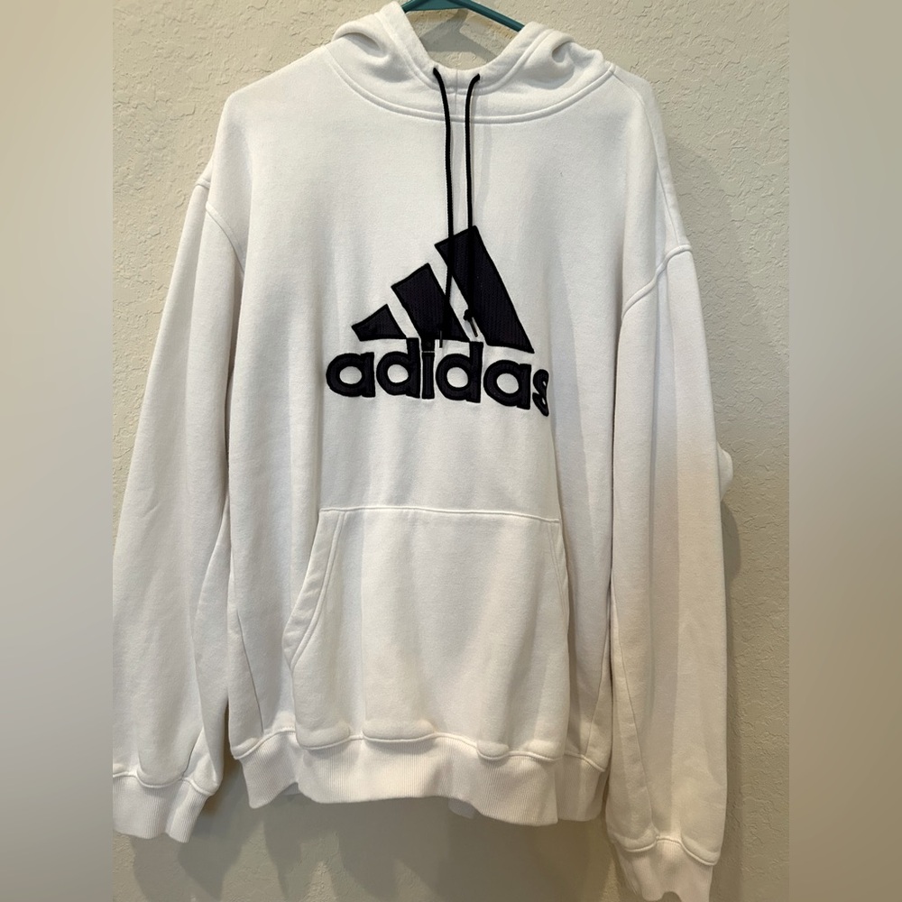 White and black pullover Adidas sweatshirt.